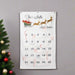 christmas countdown advent calendar decorated with candy canes in the pockets and printed with a Santa's sleigh design and personalized with a family's last name