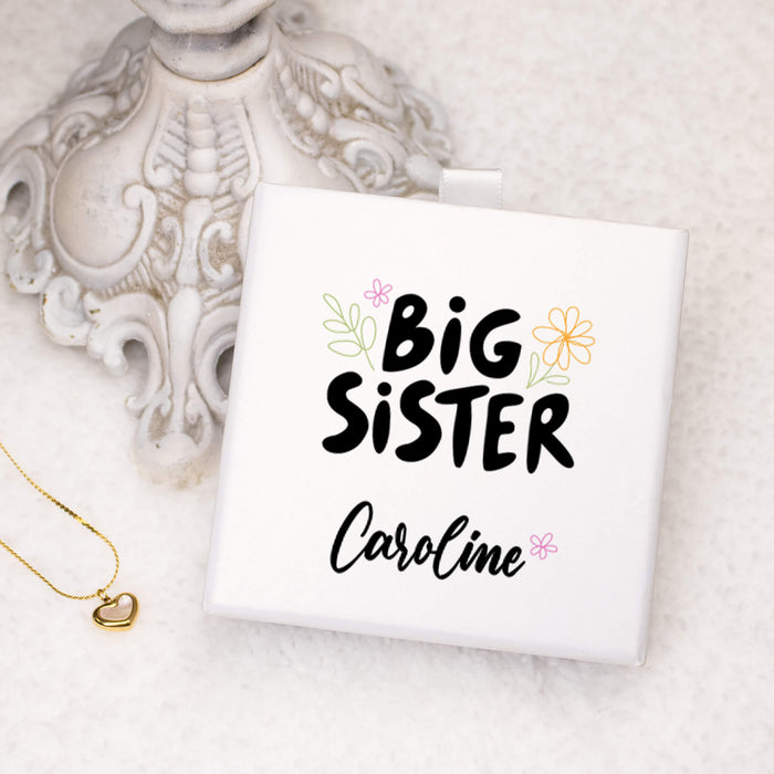 Personalized 'Big Sister' gift box with decorative elements on a light background