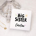 Personalized 'Big Sister' gift box with decorative elements on a light background