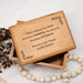 Wooden box with engraved text on a light background with forever in our hearts memorial quote