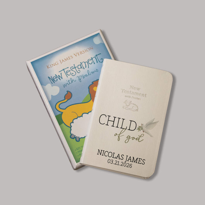 Baby bible that says "Child of God" and has a dove with an olive branch. It is personalized with a baby's name and birthday.