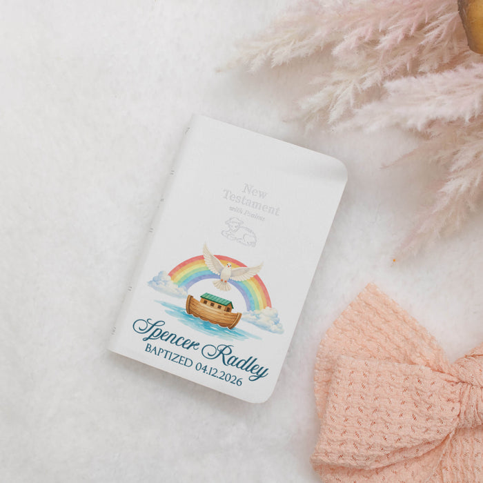 New Testament with Noah's Ark design on a white background with a pink bow and flowers