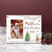 Christmas-themed picture frame for 'Baby's First Christmas 2025' with a baby photo, trees, and deer on a marble surface.