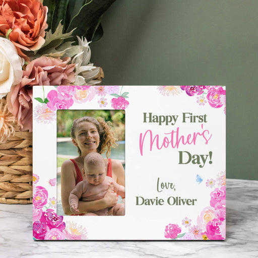 Picture frame for First Mother's Day with a photo of a woman and child, surrounded by flowers.