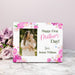Personalized photo frame for First Mother's Day with floral design and photo of a woman holding a baby.