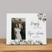 Personalized photo frame with floral design and 'Happily Ever After' text on a wooden surface