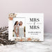 Personalized 'Mrs & Mrs' sign with two women's photo and text on a marble surface.