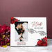 A white personalized photo frame with red rose illustrations and skeleton hands, featuring a custom wedding photo of a couple and the text 'Til Death Do Us Part' and 'Jordan & Jessa September 13, 2025'. The frame is styled on a marble surface next to a bouquet of red flowers against a dark mauve background.