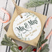 Wedding keepsake ornament shown on top of its gift box surrounded by Christmas decor and candy canes