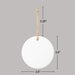 White circular ornament with twine string and measurements on a gray background