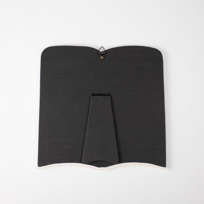 back of ceramic open book plaque