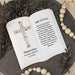 Ceramic open book with personalized text, Luke 22:19-20 bible verse, and floral design on a decorative surface