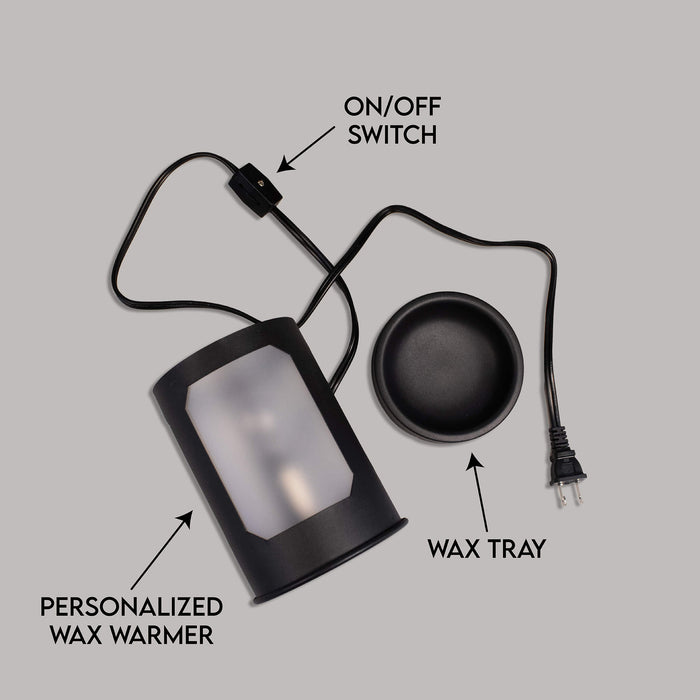 Black wax warmer with labeled parts on a gray background