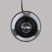The inside of a black metal wax warmer showing the bulb