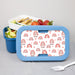 Blue bento box with a personalized rainbow patterned lid containing food on a gray background