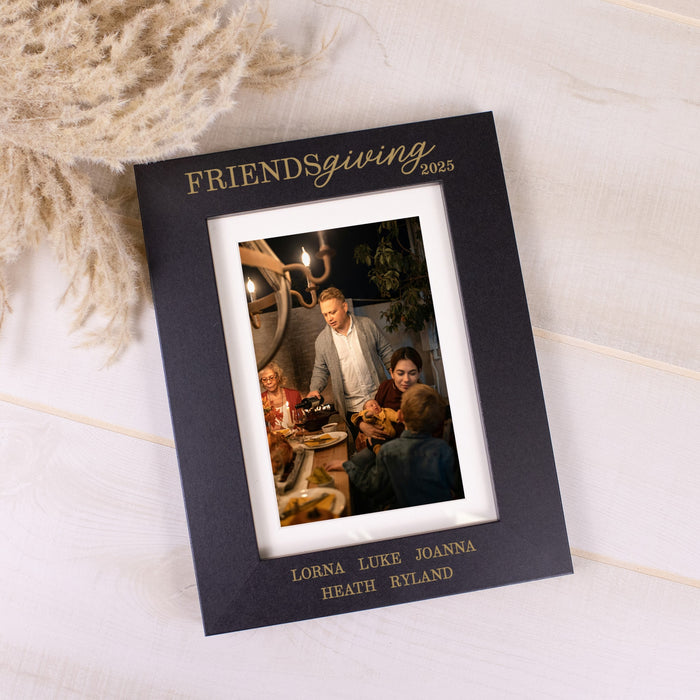 Black photo frame with 'Friendsgiving 2025' text, featuring a family photo on a light background.