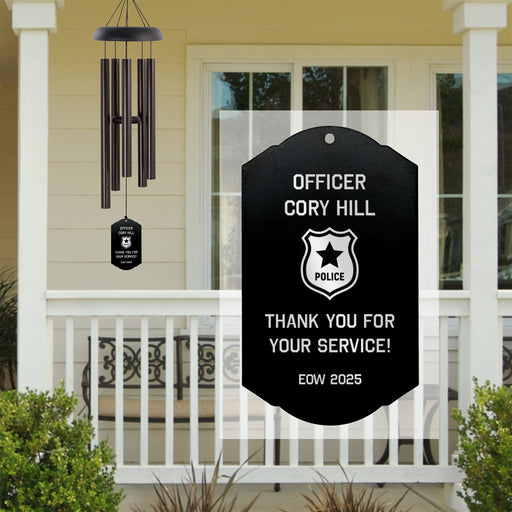 Custom engraved police retirement wind chime displayed on a porch