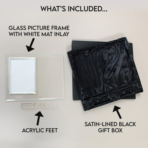 The engraved glass picture frame gift includes a white mat inlay, acrylic feet and a satin-lined black gift box