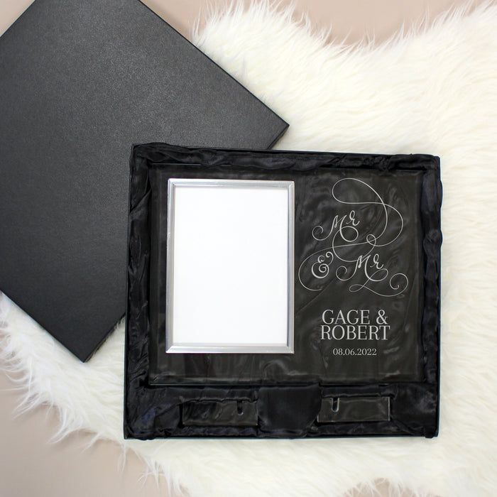 Black glass picture frame engraved with 'Mr & Mr' and personalized text inside a black gift box