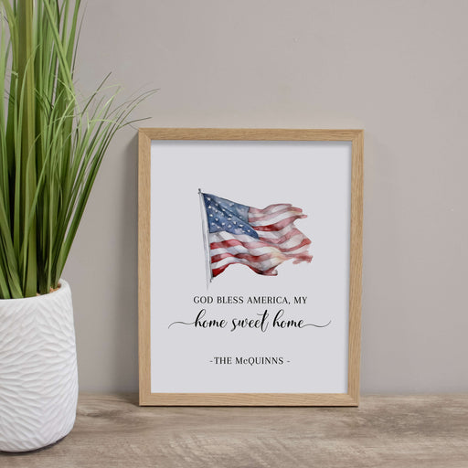Personalized God Bless American Wall Sign in Rustic Wood Sitting on Table by Plant