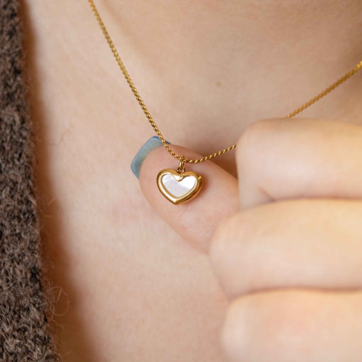 Gold heart necklace with opal center