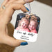 Hand holding a drive safe daddy car ornament with child's photo