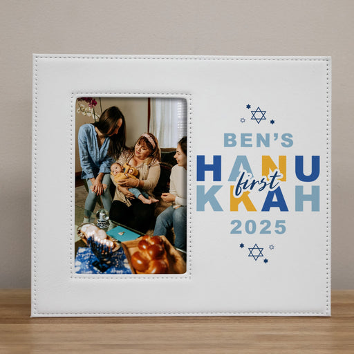 White picture frame with Baby's First Hanukkah 2025