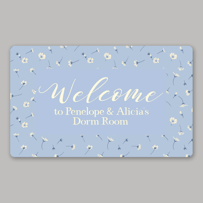 Personalized dorm room welcome mat with a blue floral pattern