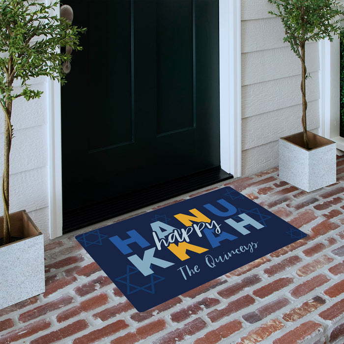 Personalized doormat with 'Happy Hanukkah' text on a brick porch