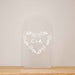 Personalized clear acrylic vase with a heart wreath that has the couple's initials in it