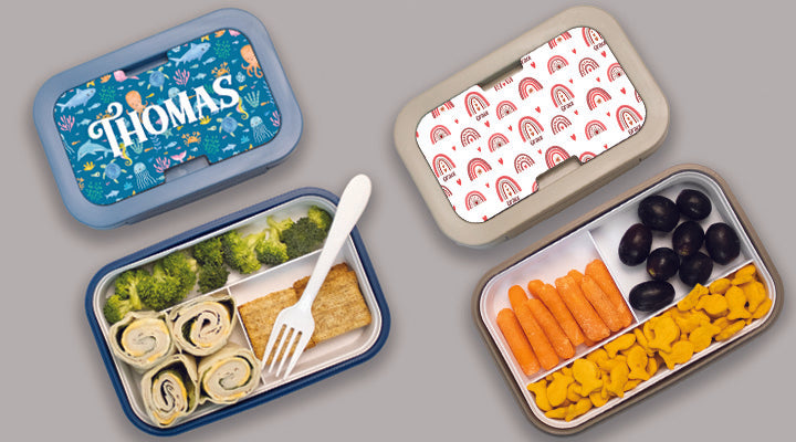 Personalized children's lunchboxes with food compartments on a light gray background