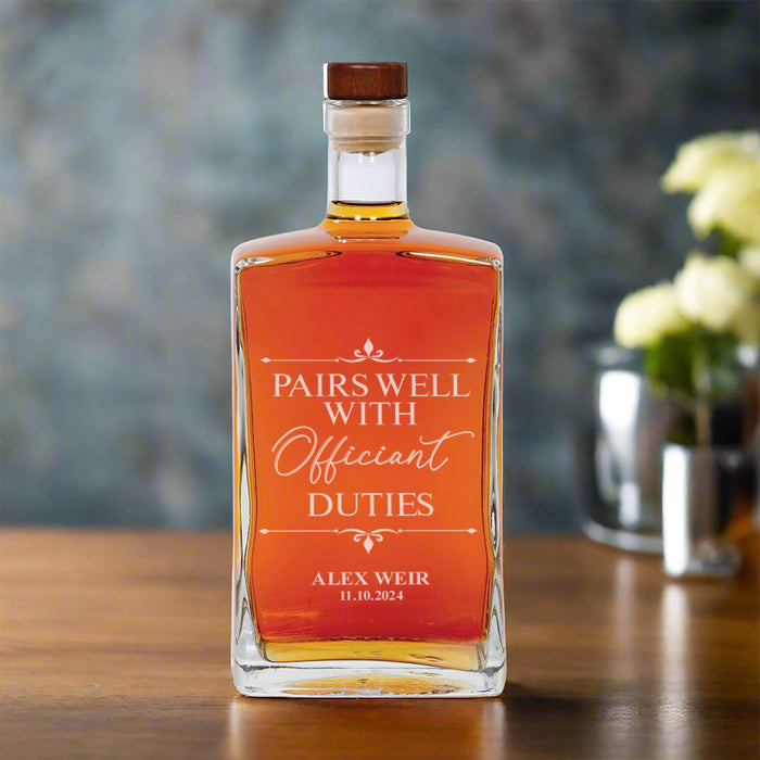 Personalized wedding officiant decanter on a table