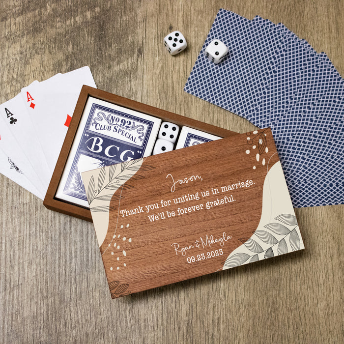 Personalized officiant thank you gift of playing cards with wooden box on a wooden surface