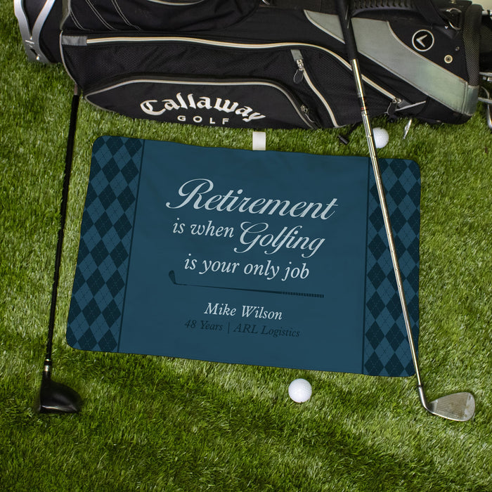 Golf mat with retirement quote on grass with golf bag