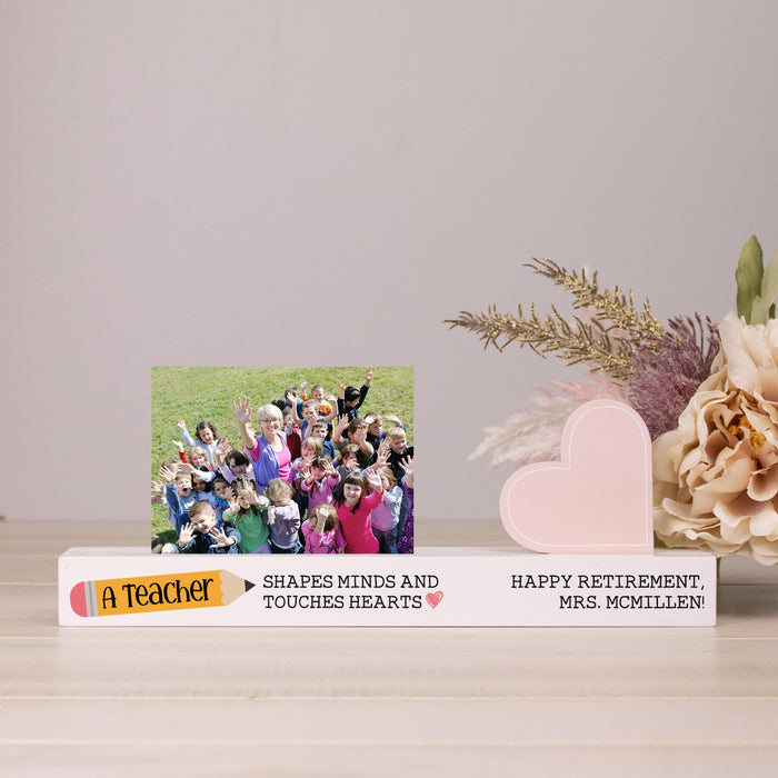 Personalized retirement gift for a teacher with a photo of children and floral arrangement.