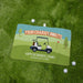 Personalized retirement golf towel with golf cart design on a grass background