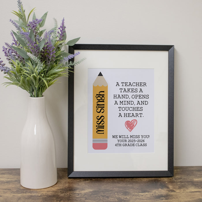 Framed print with a pencil illustration and teacher quote, placed next to a vase with flowers on a wooden surface.