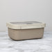 Beige storage box with a lid on a marble surface