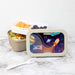 Space-themed lunch box with 'JACOB' on a marble surface