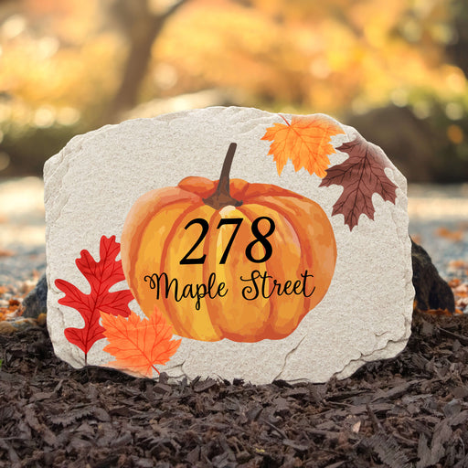 garden stepping stone with fall leaves and pumpkin design personalized with street address