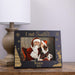 Personalized photo frame with 'I met Santa' text and decorative elements on a wooden surface.