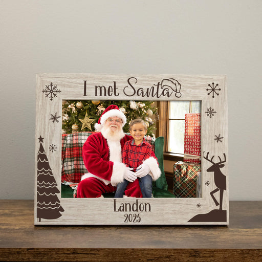 Personalized photo frame with 'I met Santa!' text, featuring a photo of a child with Santa Claus.