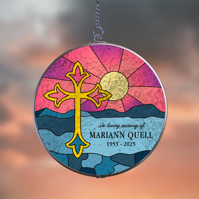 circular stained glass style acrylic suncatcher with personalized memorial and big yellow cross in front of a beach sunrise