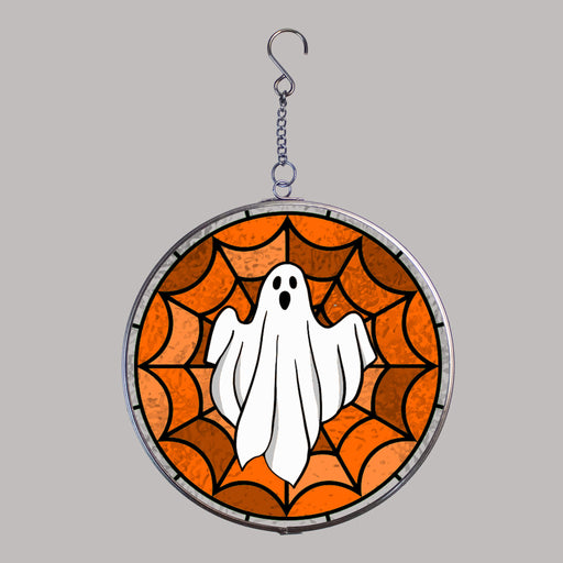 Halloween-themed stained glass window hanging with a ghost and spider web design on a gray background.
