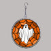 Halloween-themed stained glass window hanging with a ghost and spider web design on a gray background.