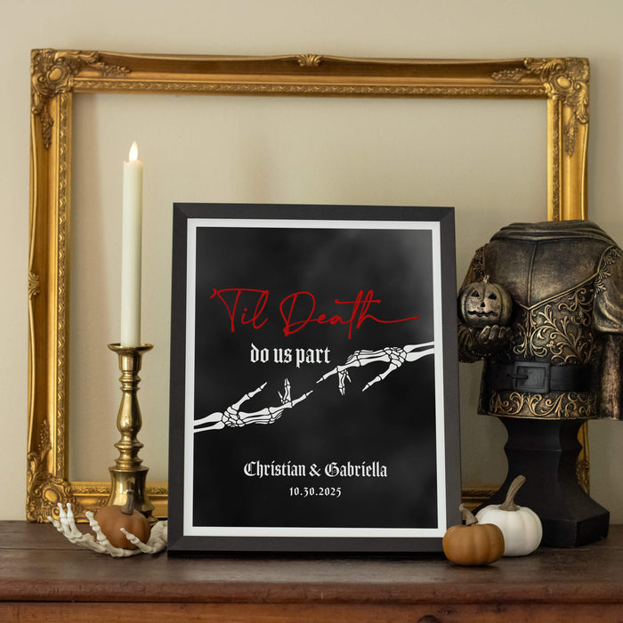 Framed print with skeleton hands and 'Til Death do us part' text on a shelf with decorative items for halloween or gothic wedding gift
