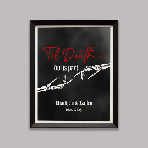 Framed artwork with skeleton hands reaching towards one another and text 'Til Death do us part' on a black foggy background
