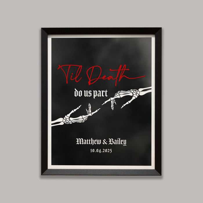 Framed artwork with skeleton hands reaching towards one another and text 'Til Death do us part' on a black foggy background
