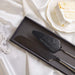 Two personalized black cake knives with in a black gift box for a gothic wedding