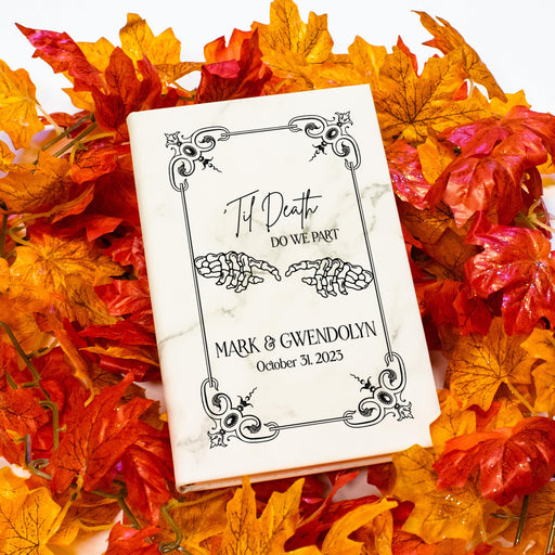 white marble halloween wedding guest book with couples names engraved